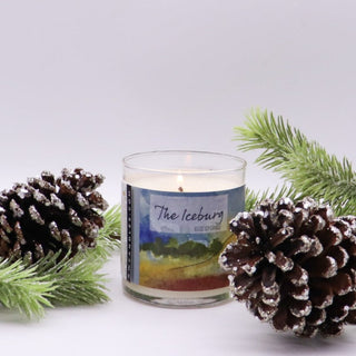 the iceburg winter candle with pinecones and juniper
