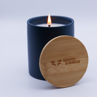 roots and wings blue ceramic candle with bamboo wood lid
