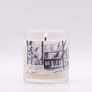 warm cozy cabin candle roots and wings